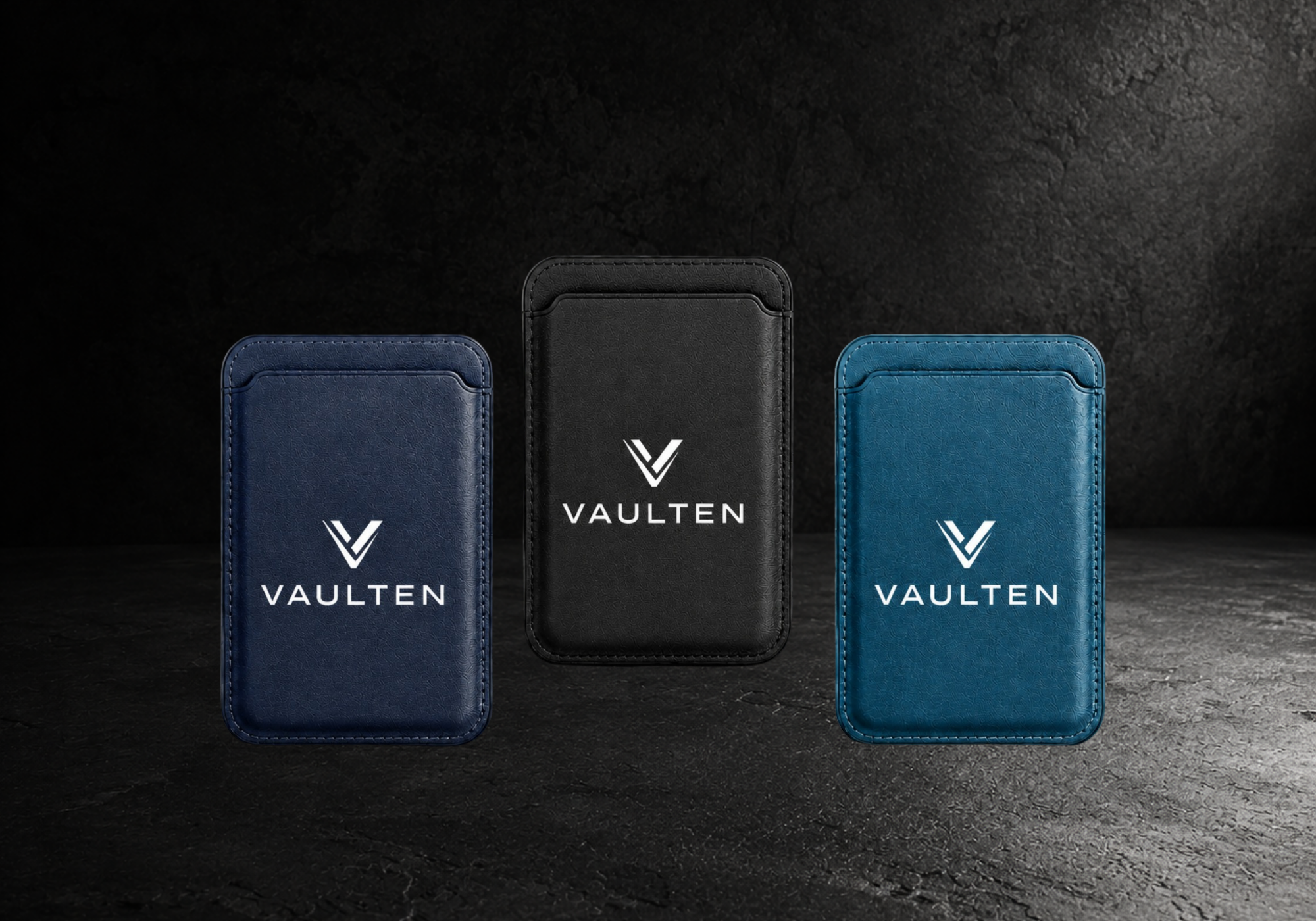 Drei VAULTEN Magnetic Slim Wallets in Navy, Schwarz und Petrol mit goldenem Logo